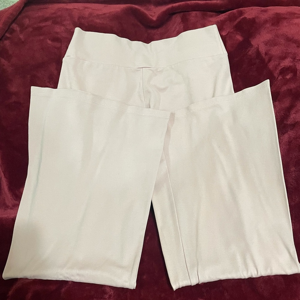 The pants are pink and are flared. They kind of stretch.